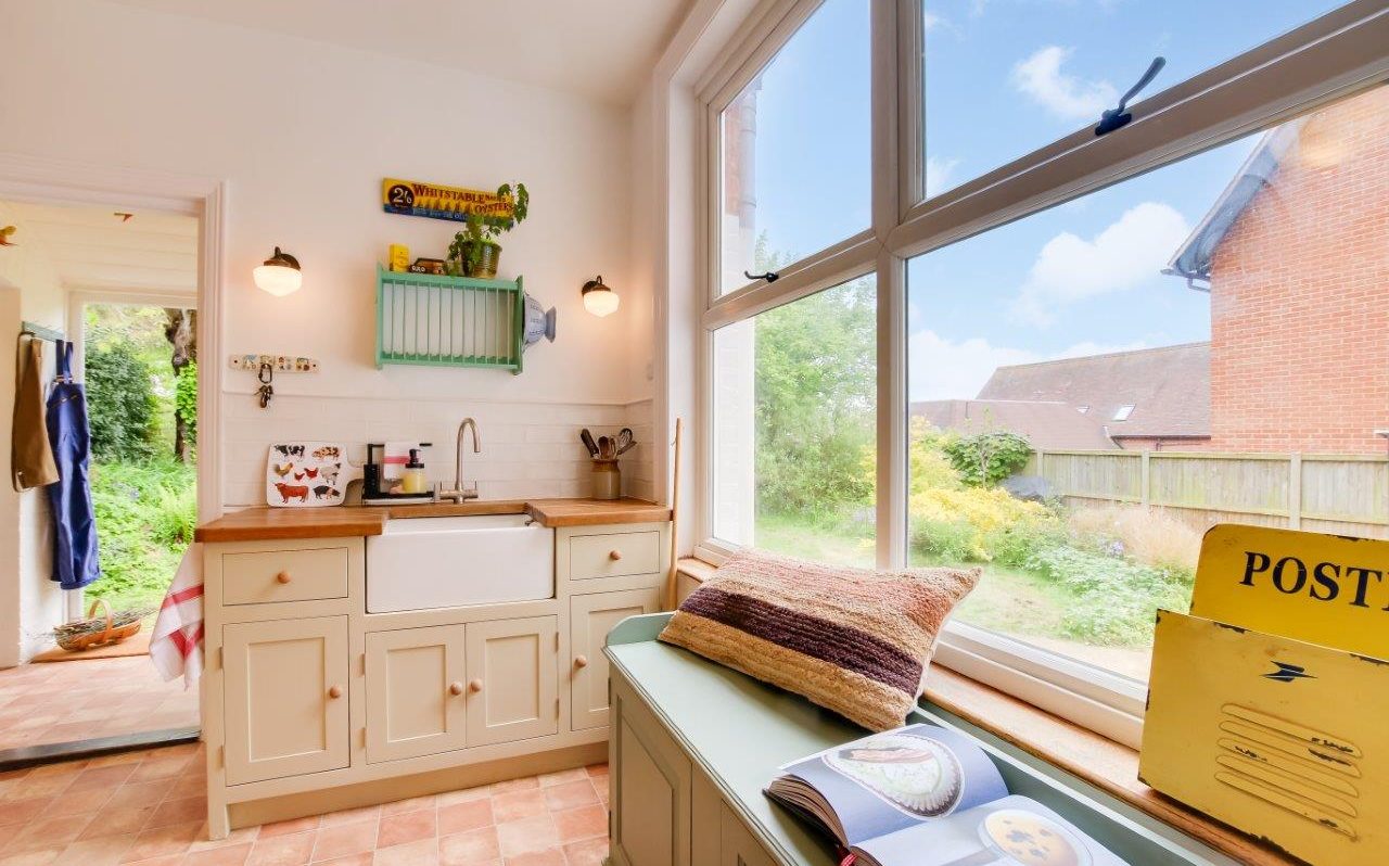 A cozy kitchen bench with an open book—symbolising thoughtful planning in home buying