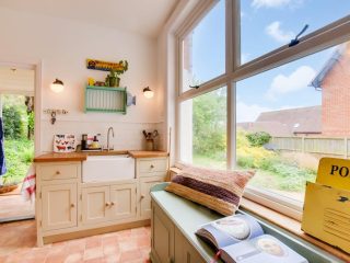 A cozy kitchen bench with an open book—symbolising thoughtful planning in home buying