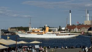 Harbour view with boats and wide July sky.