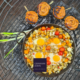 eggs cooking on a barbecue outdoors in summer garden